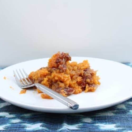 plate with a serving of sweet potato casserole with fork